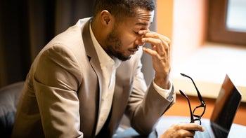 Dry eye: man with eye fatigue 1201657124