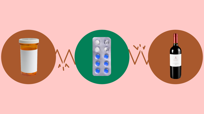 The image shows a light red background with three circles across the frame. In the center, on a green circle, is a blister pack with round blue pills. On the left, on a red circle, is an orange prescription bottle. On the right, on a red circle, is a red wine bottle. 
