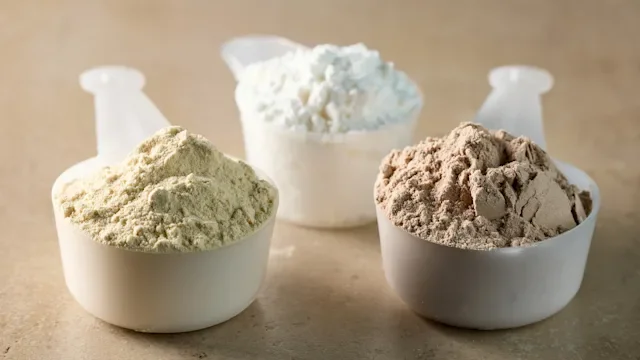 supplements-herbs: scoops of protein powder 2232904990