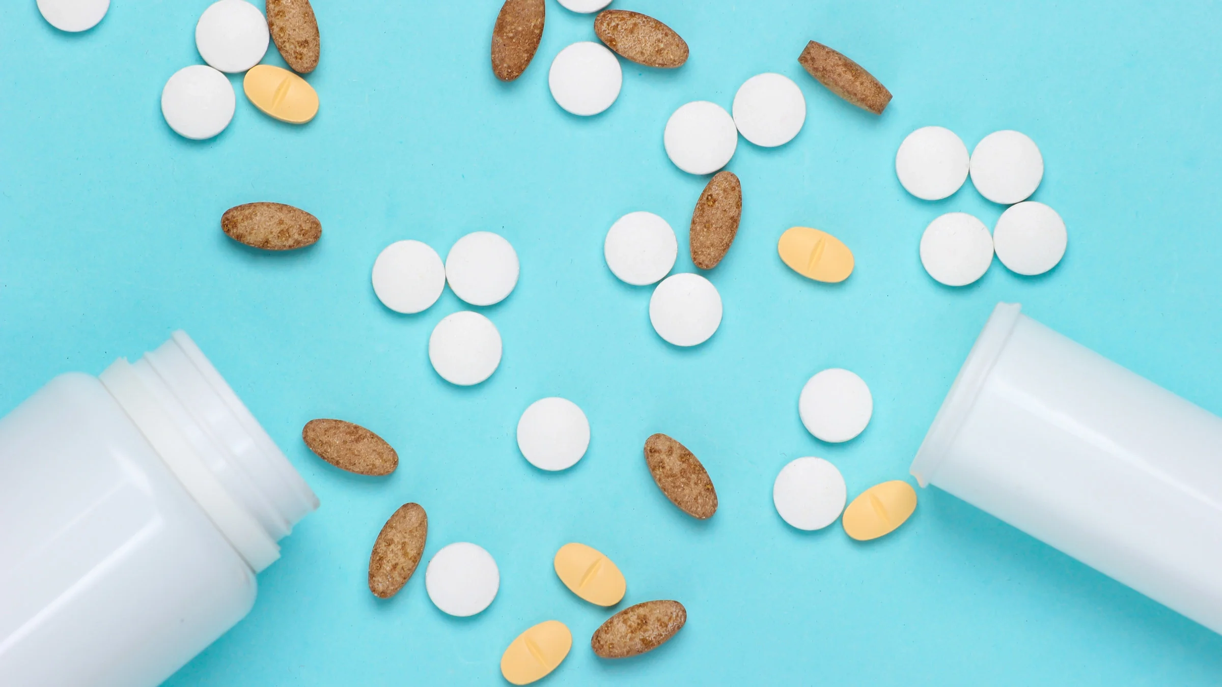 Two pill bottles and pills.