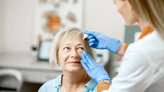 Health: Eye: senior woman eye drops 1178489719