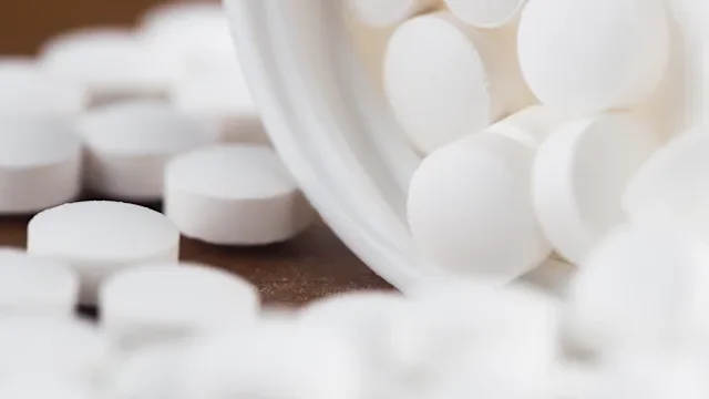 closeup white pills bottle 1358388214