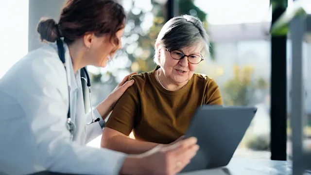 woman and HCP reading a tablet 2267048145
