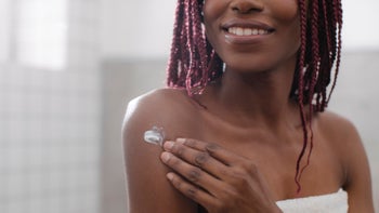Health: Skin Health: woman putting on cream 1175568855