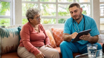 Health: Xeljanz: healthcare professional speaking to patient 1435010406
