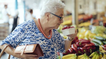 Diet Nutrition: Fruit: senior woman buying rasberries 1363106493