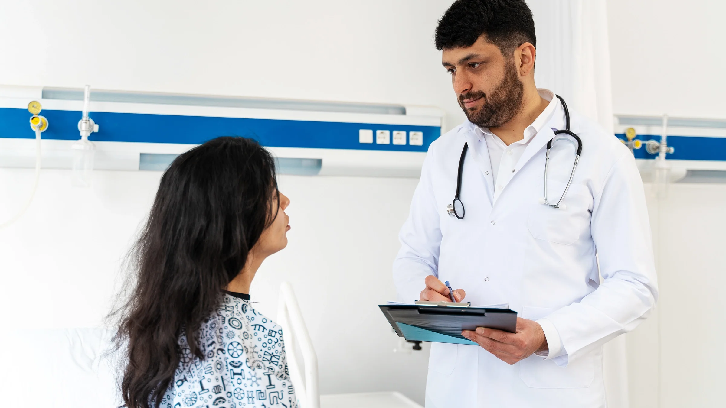A woman talks with her healthcare professional during a medical appointment.