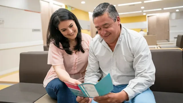 Insurance: EPO: reading brochure waiting room 960073184