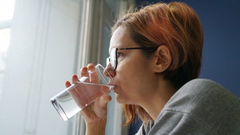 gynecology: woman drinking water 1798621445