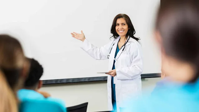 Health: Providers: doctor teaching class 1012627410
