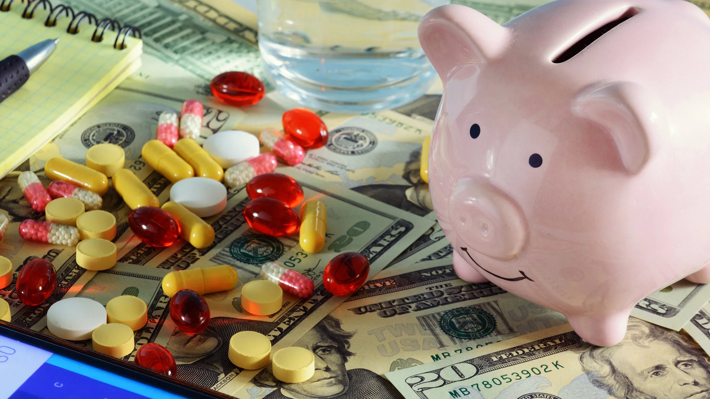 Pills, a piggy bank, and a calculator.