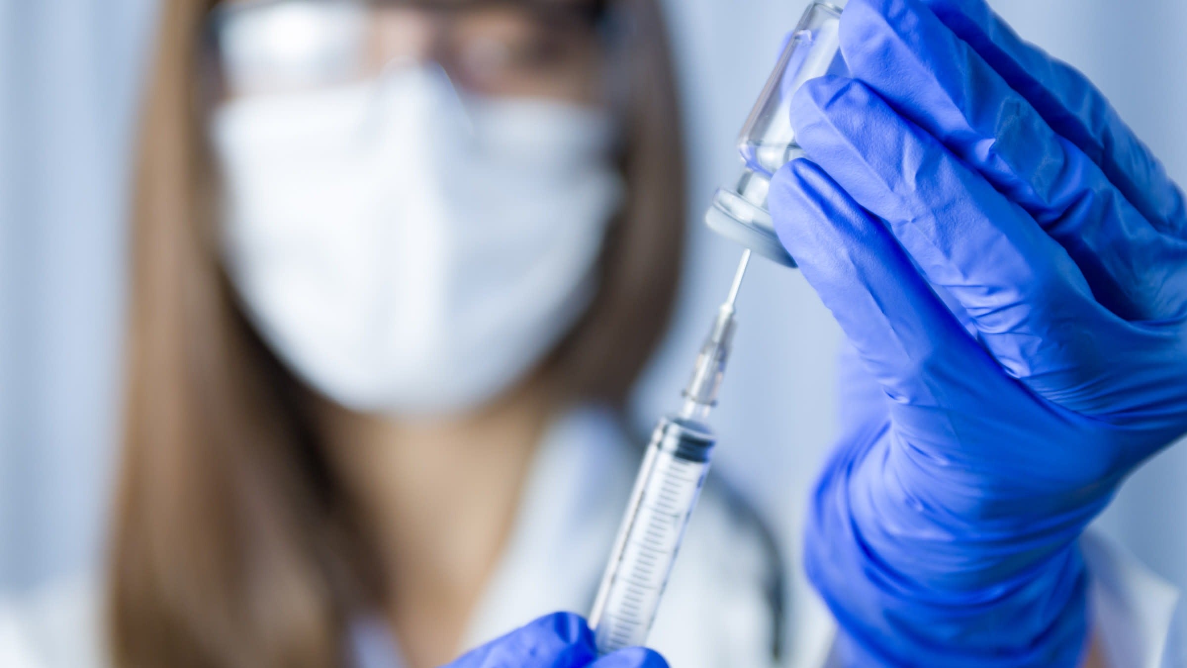 Hep C: scientist holding vaccine 1302343823