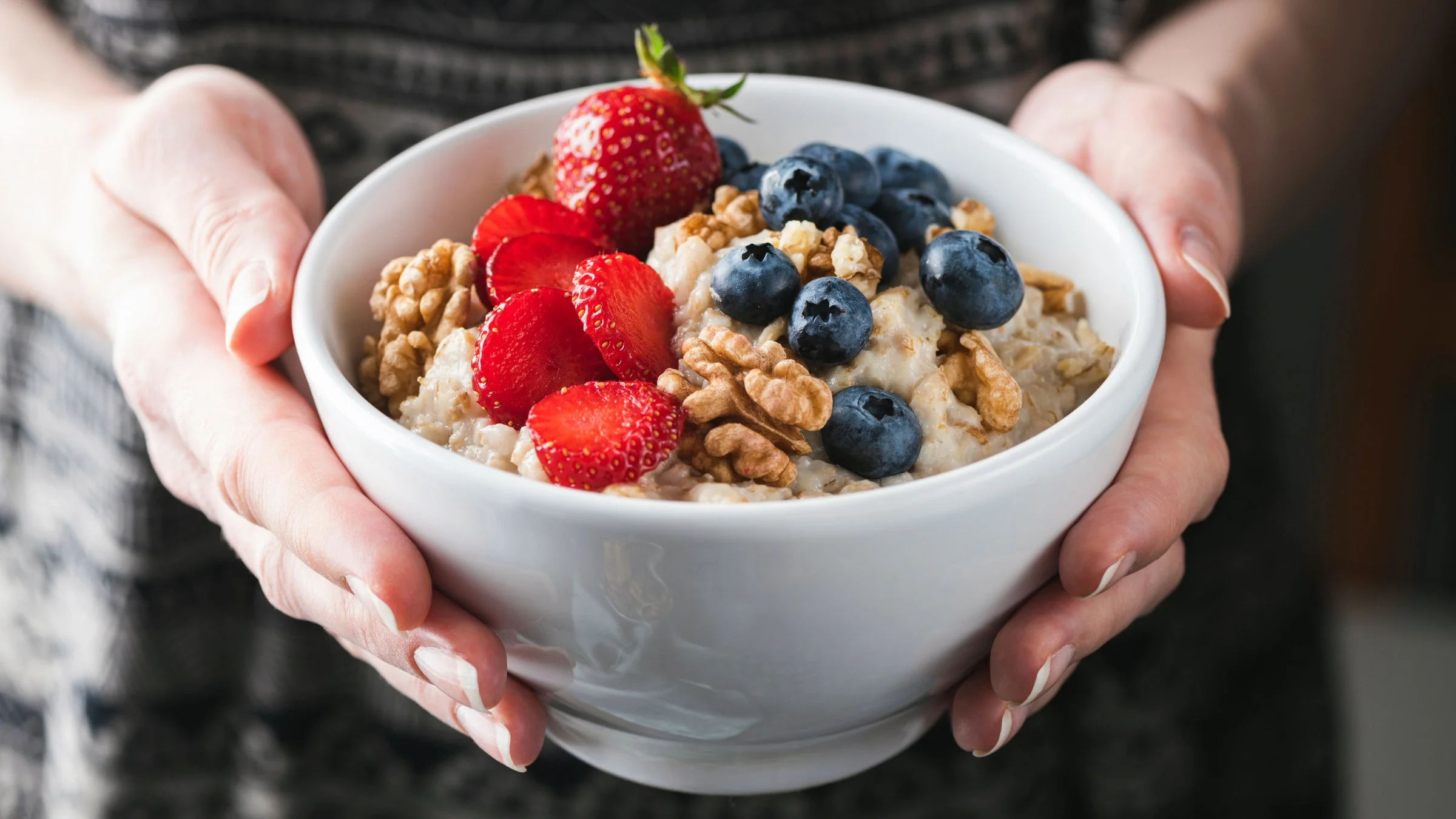 Close-up of oatmeal with fruit and nuts.