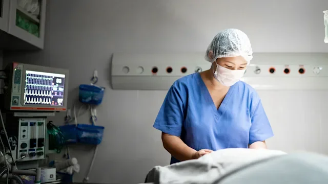 Health: Fertility: surgeon prepping in operating room 1318323724