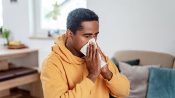 Sinus infection: man blowing nose 1333957500