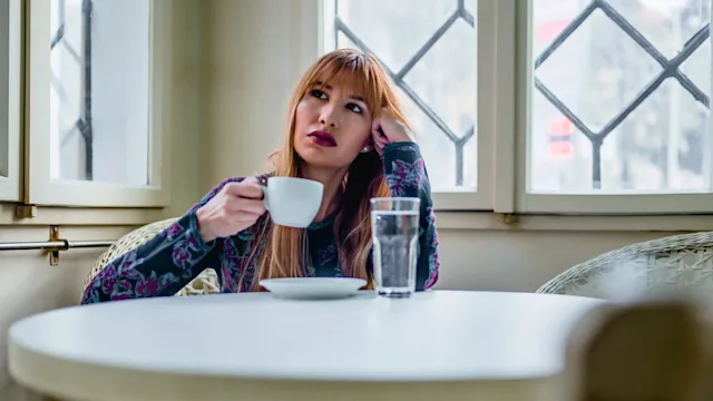 Mental health: drinking coffee in contemplation 1194744622