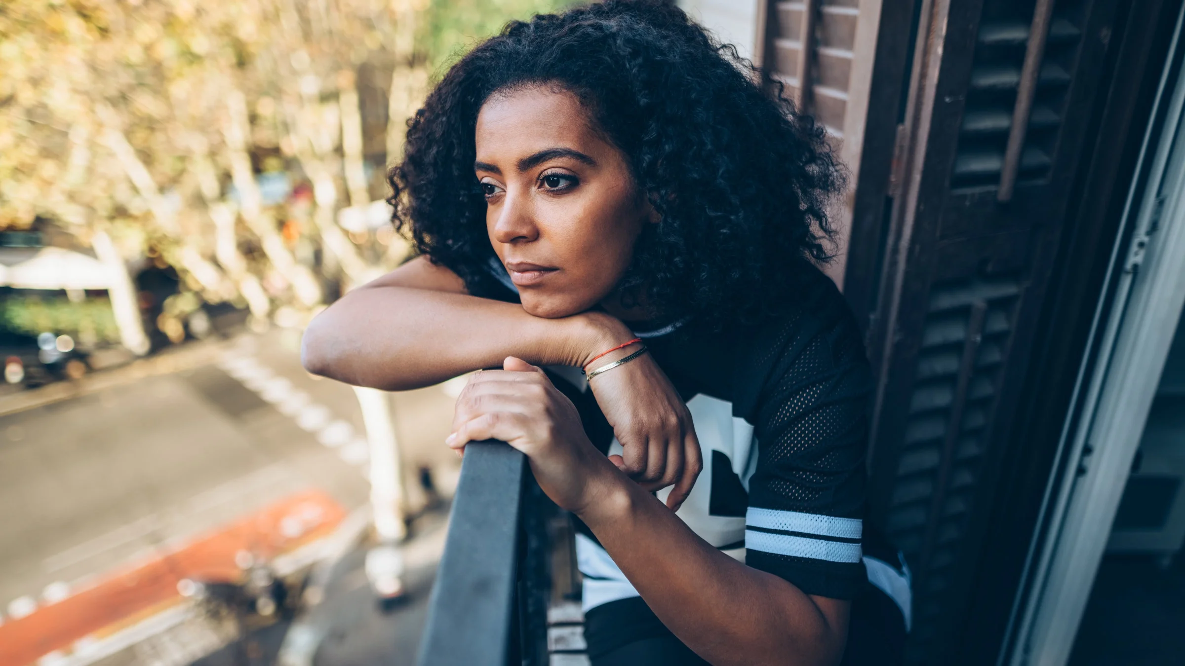 A depressed person on their balcony.