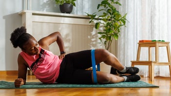 Movement exercise: woman exercising with resistance band 1582578454