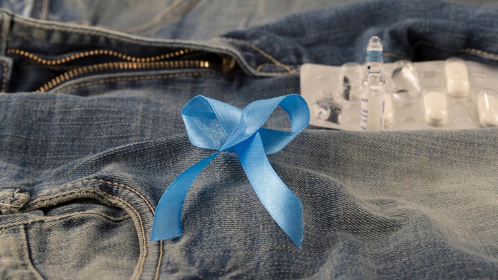Blue ribbon and meds on jeans. 