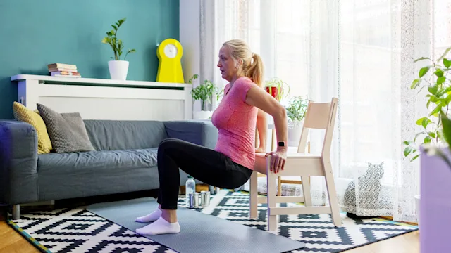 Movement-exercise: woman tricep dip chair exercise 1297422640