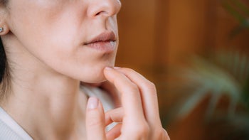 Alternative-treatments: closeup EFT tapping beneath lips 1401859715