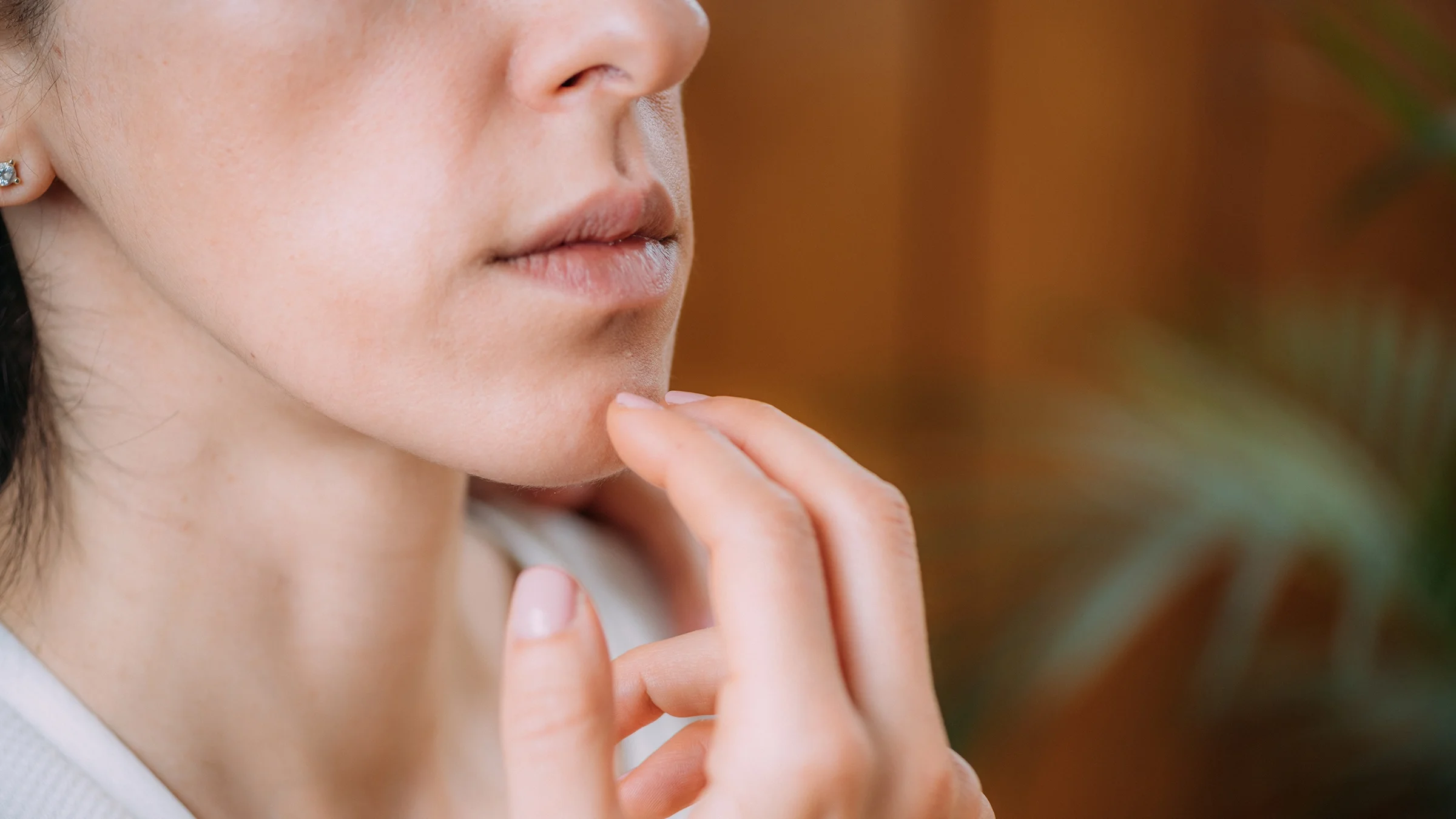 Close-up EFT tapping beneath lips