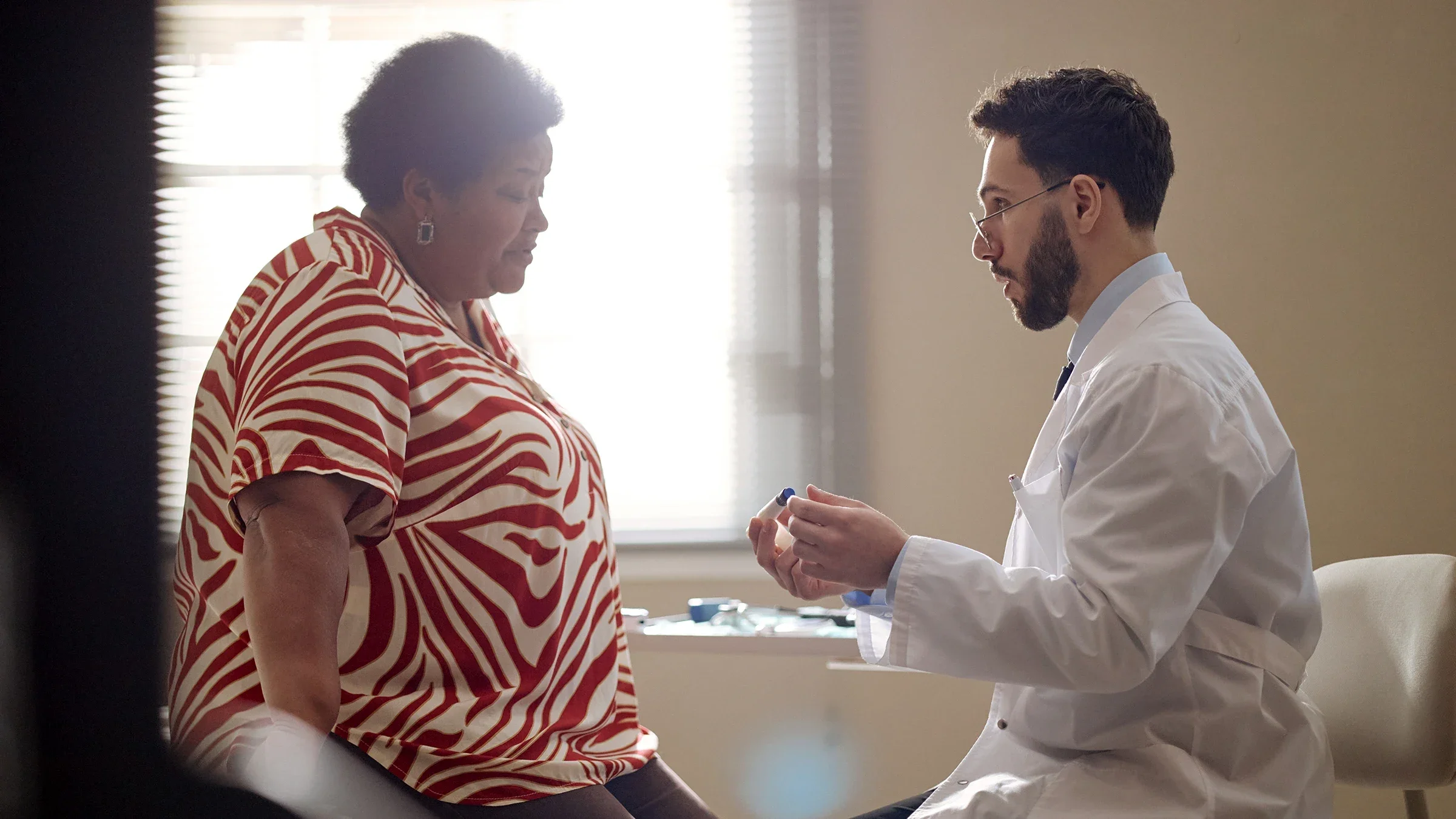 A healthcare professional explains how to use an injection pen.
SeventyFour/iStock via Getty Images Plus