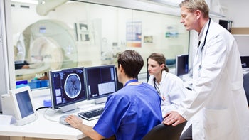 procedures: doctors checking brain scan-158133495