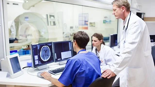 procedures: doctors checking brain scan-158133495