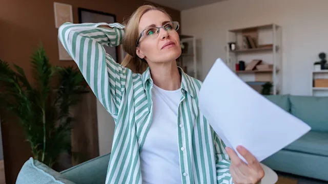 Menopause: woman having a hot flash 2231131350