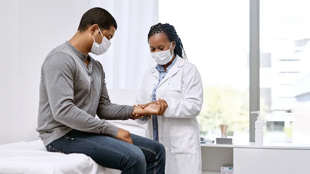 Health: Diagnostics: doctor checking patient pulse 1301555103