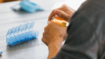 Health: Hydralazine: closeup man opening rx 1295099856