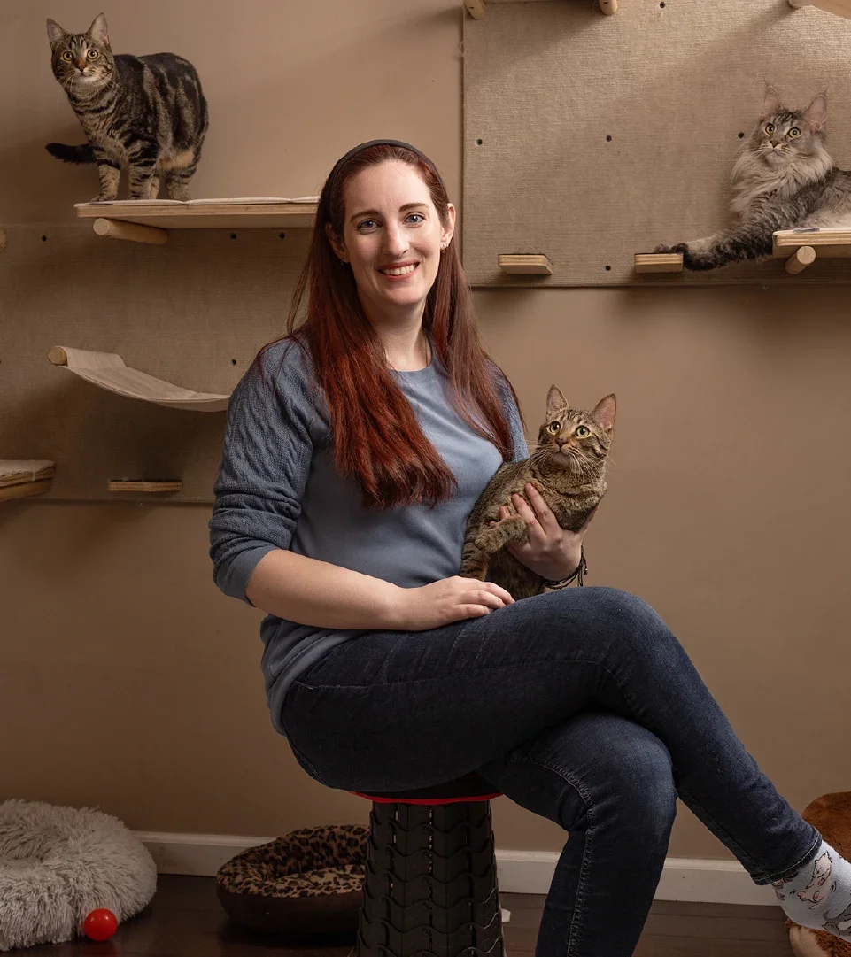 Kayla Delcoure is pictured holding her cat.