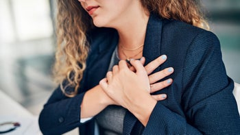 Side effects: Heartburn: cropped shot businesswoman chest pain 1149501978