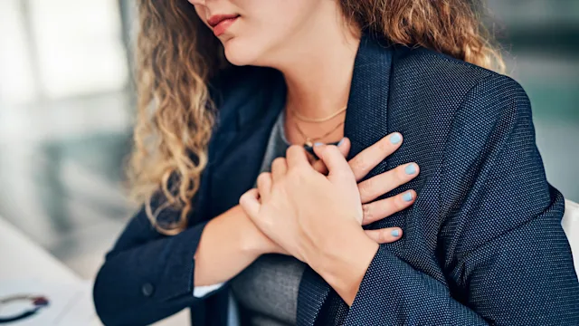 Side effects: Heartburn: cropped shot businesswoman chest pain 1149501978