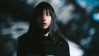 Mental health: portrait young adult half in shadow 1090472524