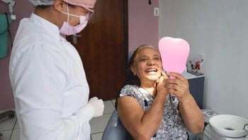 Dental care: senior woman at dentist 1350000300