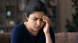 A woman is experiencing dizziness or blurry vision.
fizkes/iStock via Getty Images Plus
