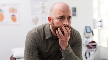dicyclomine: man with anxiety at medical appointment 2123088954