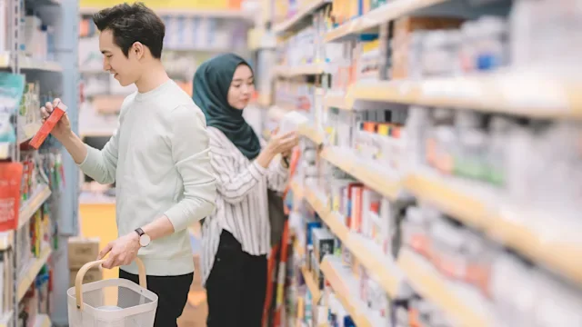 Medication education: pharmacy aisle two people 1214910639