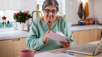 Medicare: senior adult calculating finances 1469991549