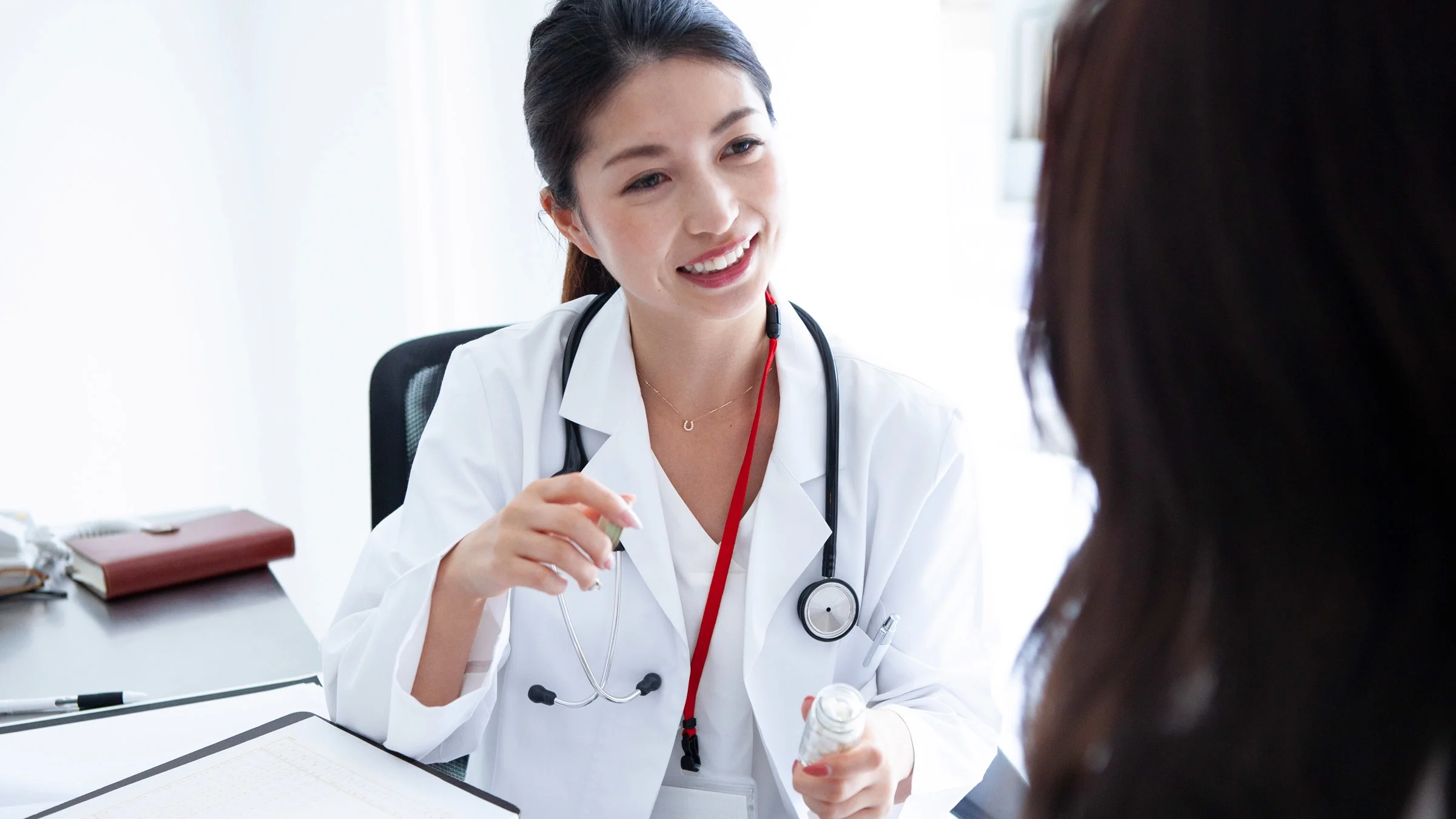 A doctor explaining medication to a patient.