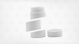 Gray background with halftone texture and warning sign pattern. In the center is a white pill bottle with the cap off to the side cut into thirds.
GoodRx Health