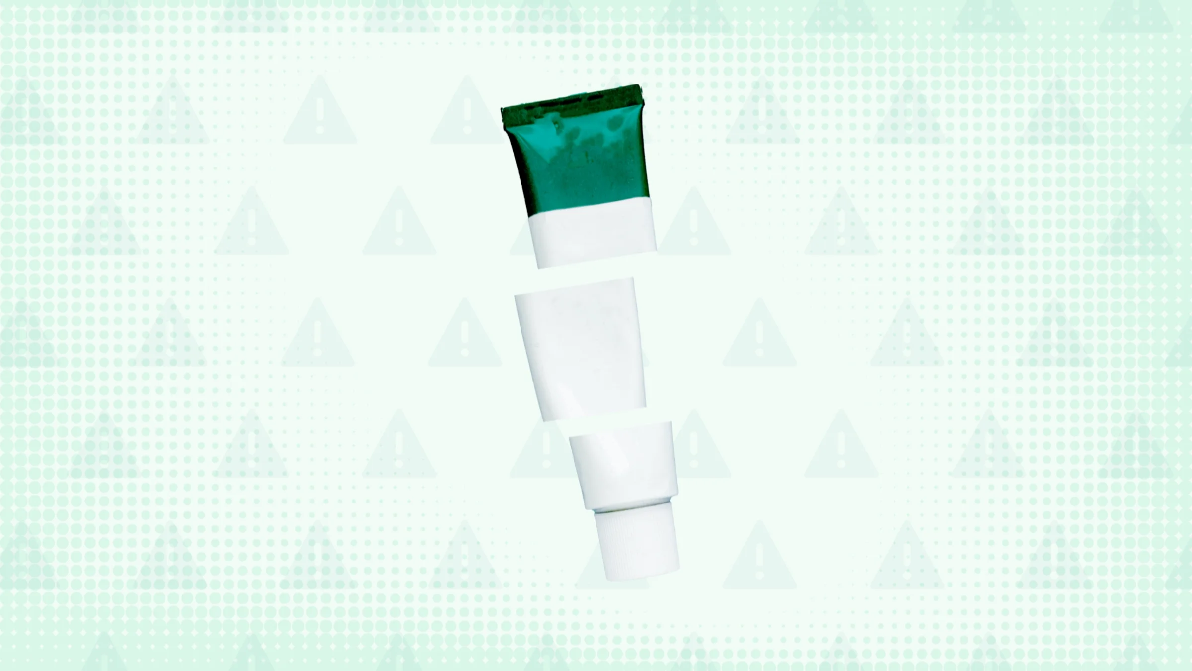 Light green background with texture and warning sign pattern. In the center is a white and green tube of cream cut into thirds.