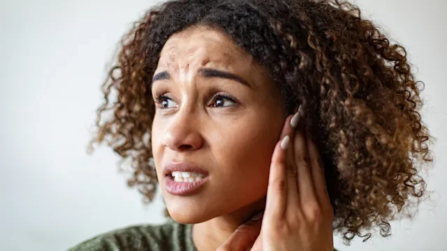 vertigo: ear: head: woman: ear pain vertigo-1187713025