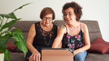 Medicare: Open enrollment: helping grandparent with tablet technology 1333004118