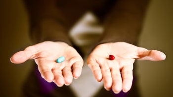 medication education : ir vs xr drugs : woman holding pills in palms GettyImages 154902903