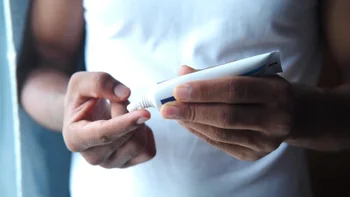Dermatology: closeup ointment on finger 1330421118