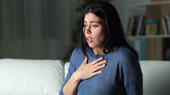 Woman gasping for air.