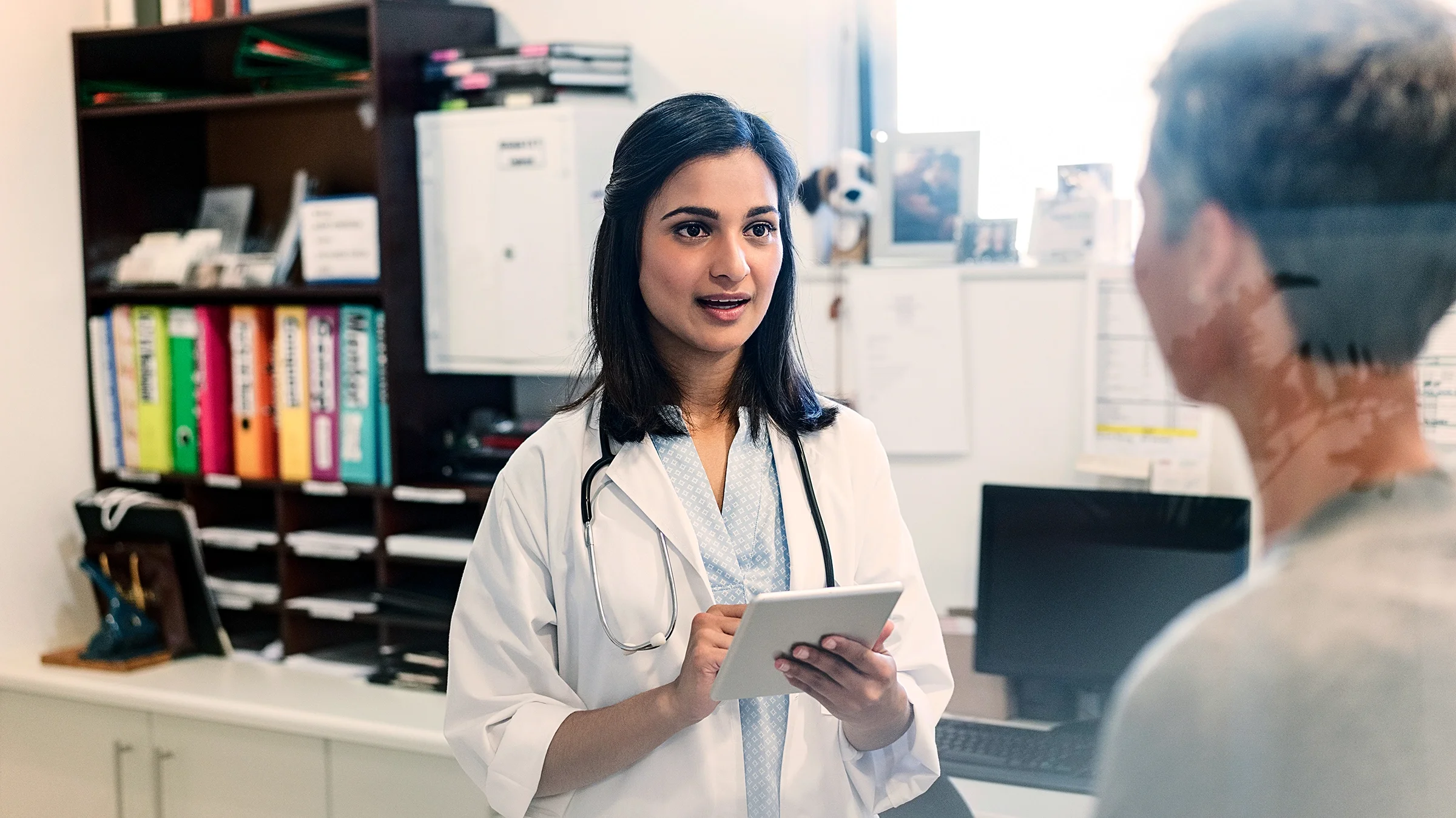 A doctor speaks with a patient.